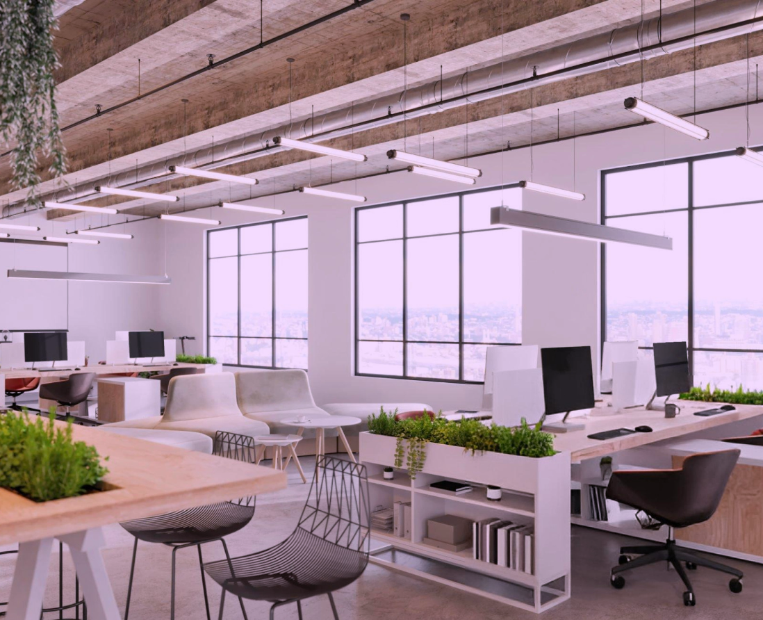 Co-working environment with modern furniture and tech devices in use